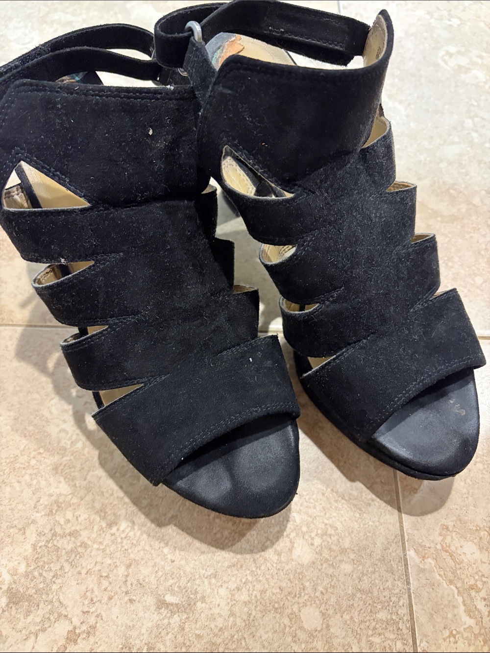 Well worn black platform heels